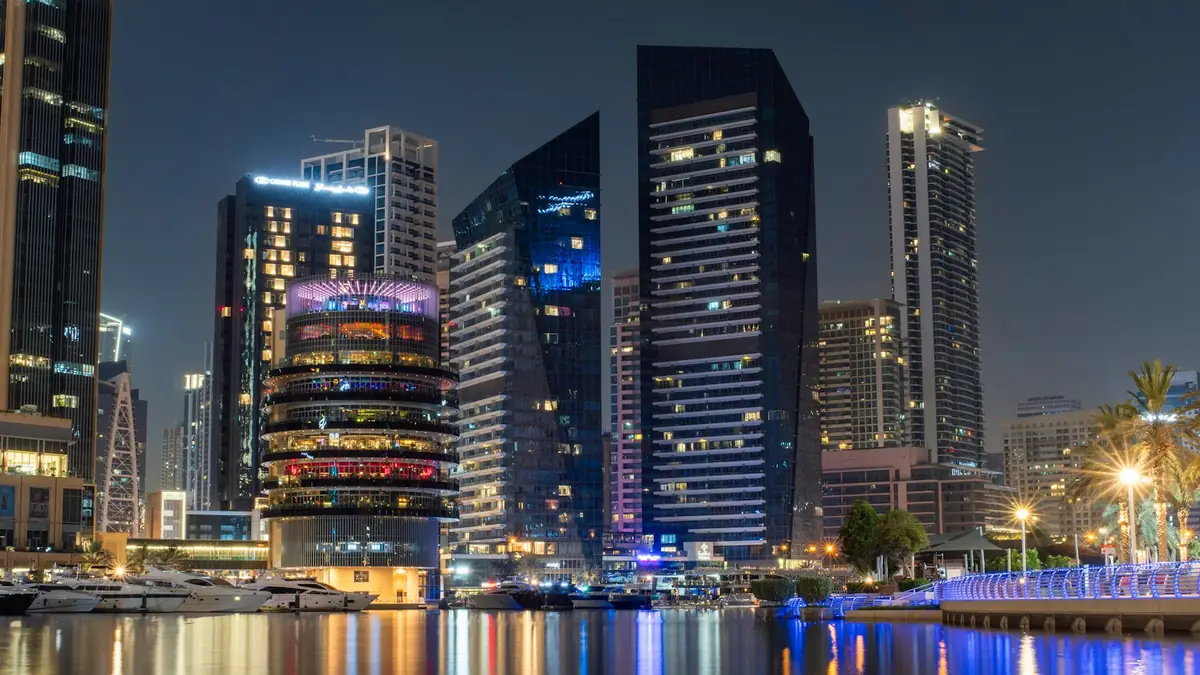 Dubai Marina towers and waterfront lit up at night