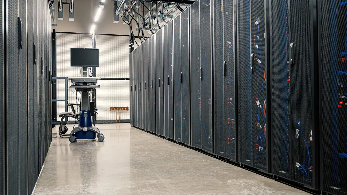 Aisle of server racks in a data center
